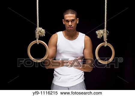 Gymnast man on Rings. View Large Photo Image Stock Photography - Gymnast man on Rings.. Fotosearch