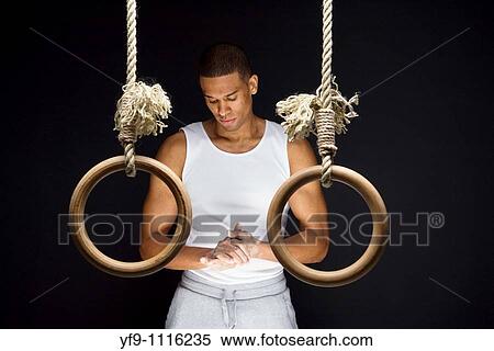 Gymnast man on Rings. View Large Photo Image Stock Photography - Gymnast man on Rings.. Fotosearch