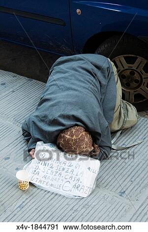 Gypsi woman begging on a walkside in Florence, Tuscany, Italy View Large Photo Image Stock Image - Gypsi woman begging on a walkside in Florence, Tuscany, Italy. Fotosearch