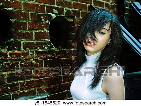 Hair covering the face of a young female View Large Photo Image Stock Image - Hair covering the face of a young female. Fotosearch