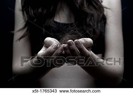 Hair Loss phobia young teen of 17 holding strands of hair View Large Photo Image Stock Image - Hair Loss phobia young teen of 17 holding strands of hair. Fotosearch