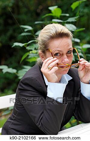 Half body image of caucasian woman sitting on a bench, Hamburg, Germany, Europe. View Large Photo Image Stock Photograph - Half body image of caucasian woman sitting on a bench, Hamburg, Germany, Europe.. Fotosearch