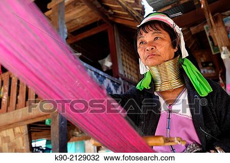 Half body image of Longneck Karen woman sitting on the floor and weaving a pink scarf, Mae Hong Son, Thailand, Southeast Asia. View Large Photo Image Stock Image - Half body image of Longneck Karen woman sitting on the floor and weaving a pink scarf, Mae Hong Son, Thailand, Southeast Asia.. Fotosearch