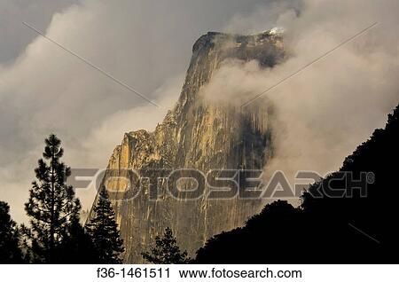 Half Dome emerges from storm clouds at sunset, Yosemite Valley, Yosemite National Park, California View Large Photo Image Stock Image - Half Dome emerges from storm clouds at sunset, Yosemite Valley, Yosemite National Park, California. Fotosearch