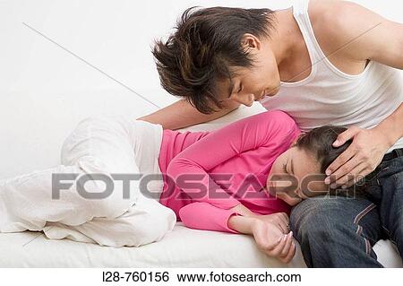Half Dressed Young Couple staying on a Sofa View Large Photo Image Stock Photograph - Half Dressed Young Couple staying on a Sofa. Fotosearch