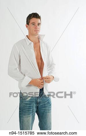Half-length photograph of a teenage boy standing by getting a white shirt. View Large Photo Image Stock Photography - Half-length photograph of a teenage boy standing by getting a white shirt.. Fotosearch