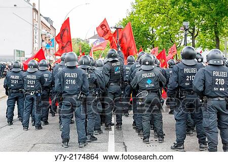 Picture - HAMBURG, GERMANY - MAY 1, 2014: Protesters clash with police during the annual May Day demonstration in Hamburg, Germany on May 1, 2014.. Fotosearch