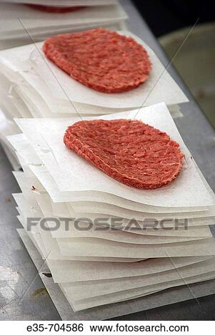 Hamburger patties, prepared food, meat factory, pre-shaped meat, meat production, meat processing plant View Large Photo Image Stock Photograph - Hamburger patties, prepared food, meat factory, pre-shaped meat, meat production, meat processing plant. Fotosearch