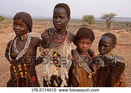 Hamer girls in their village near Turmi in the Omo Valley, Ethiopia. View Large Photo Image Stock Image - Hamer girls in their village near Turmi in the Omo Valley, Ethiopia.. Fotosearch