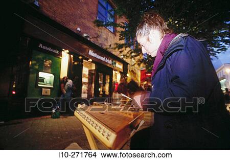Picture - Hammered dulcimer player in a street of Kilarney. County Kerry. Ireland. Fotosearch