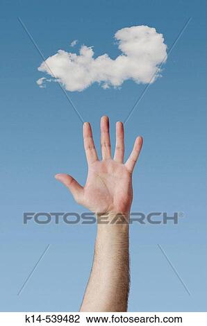 Stock Image - Hand and cloud.. Fotosearch