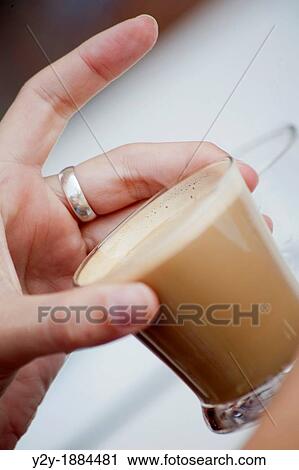 Hand and creamy coffe View Large Photo Image Stock Image - Hand and creamy coffe. Fotosearch
