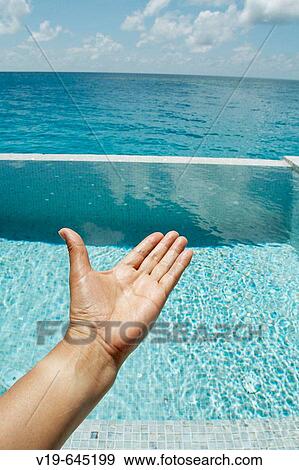 Hand and swimming pool. Maldives Island, Indian Ocean. View Large Photo Image Stock Photo - Hand and swimming pool. Maldives Island, Indian Ocean.. Fotosearch