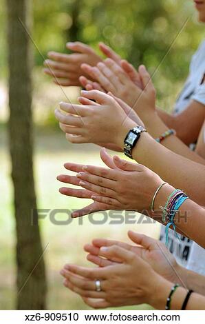 Stock Image - hand clapping girls. Fotosearch