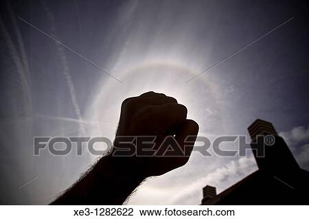 Stock Image - Hand gesture, backlit. Fotosearch