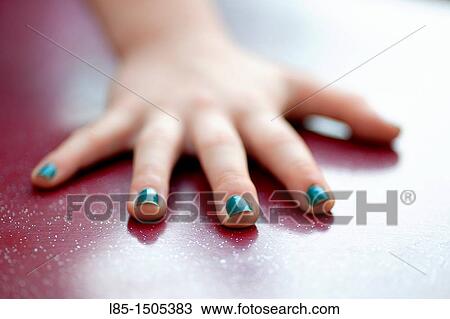 Hand girl with painted nails View Large Photo Image Stock Image - Hand girl with painted nails. Fotosearch