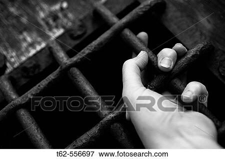 Hand hanging on grill. View Large Photo Image Stock Photo - Hand hanging on grill.. Fotosearch