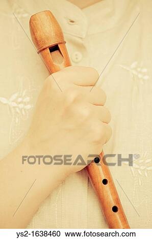 Hand holding a flute View Large Photo Image Stock Image - Hand holding a flute. Fotosearch
