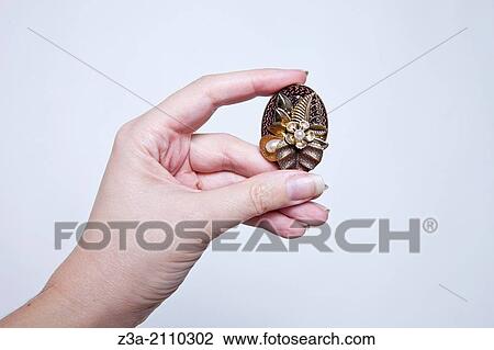 Hand Holding Antique Broche, Hand Gesture, Studio shot View Large Photo Image Stock Image - Hand Holding Antique Broche, Hand Gesture, Studio shot. Fotosearch