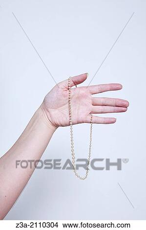 Hand Holding Antique Necklace, Hand Gesture, Studio shot View Large Photo Image Picture - Hand Holding Antique Necklace, Hand Gesture, Studio shot. Fotosearch