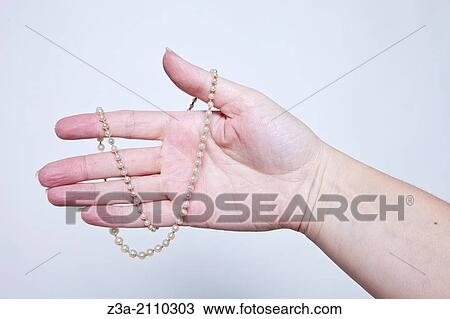 Hand Holding Antique Necklace, Hand Gesture, Studio shot View Large Photo Image Stock Image - Hand Holding Antique Necklace, Hand Gesture, Studio shot. Fotosearch
