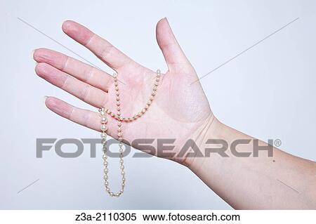 Hand Holding Antique Necklace, Hand Gesture, Studio shot View Large Photo Image Stock Photography - Hand Holding Antique Necklace, Hand Gesture, Studio shot. Fotosearch