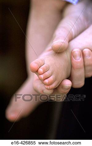 Hand holding baby foot. View Large Photo Image Stock Photography - Hand holding baby foot.. Fotosearch