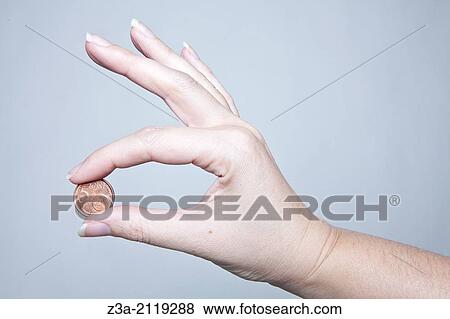 Hand holding five eurocent coin. View Large Photo Image Stock Photo - Hand holding five eurocent coin.. Fotosearch