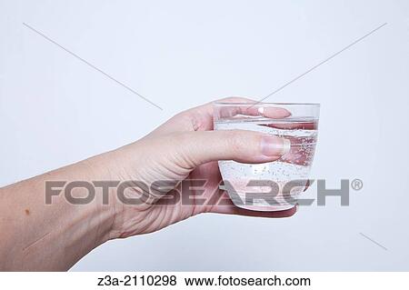 Hand Holding Glass Of Water, Hand Gesture, Studio shot View Large Photo Image Stock Photo - Hand Holding Glass Of Water, Hand Gesture, Studio shot. Fotosearch