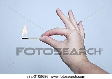 Hand Holding Matchstick, Hand Gesture, Studio shot View Large Photo Image Stock Photograph - Hand Holding Matchstick, Hand Gesture, Studio shot. Fotosearch