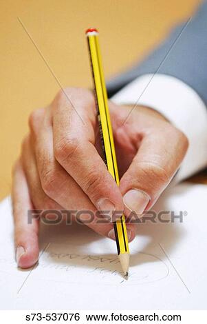 Hand holding pencil View Large Photo Image Stock Photograph - Hand holding pencil. Fotosearch