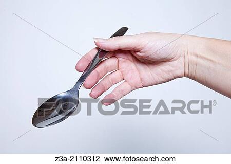 Hand Holding Spoon, Hand Gesture, Studio shot View Large Photo Image Stock Image - Hand Holding Spoon, Hand Gesture, Studio shot. Fotosearch