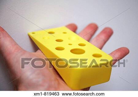 Hand holding yellow cheese door wedge View Large Photo Image Stock Image - Hand holding yellow cheese door wedge. Fotosearch