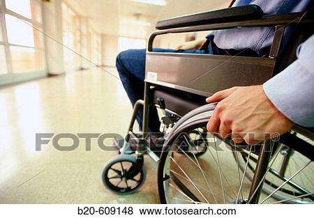Stock Photo - Hand in wheelchair. Fotosearch