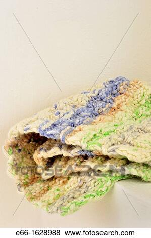 Hand knit washcloth on shelf by window, close up View Large Photo Image Stock Photo - Hand knit washcloth on shelf by window, close up. Fotosearch