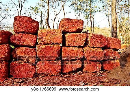 Hand made cutting red stone bricks name? CHIRE? in Goa, India View Large Photo Image Stock Photo - Hand made cutting red stone bricks name? CHIRE? in Goa, India. Fotosearch