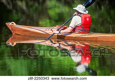Hand made wood canoe. Reflection in water. Colorful. Horizontal. View Large Photo Image Stock Image - Hand made wood canoe. Reflection in water. Colorful. Horizontal.. Fotosearch