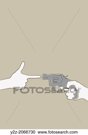 Stock Image - Hand making gun gesture pointing at a revolver.. Fotosearch