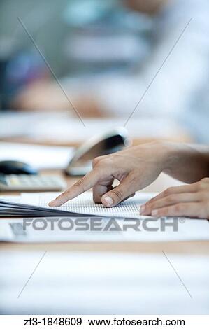 Hand of a woman working in her desktop View Large Photo Image Stock Photo - Hand of a woman working in her desktop. Fotosearch