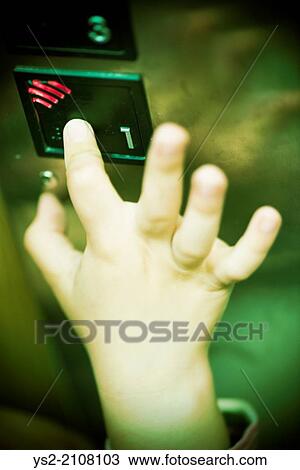 Hand of child pressing button in elevator, ominous and scary mood. View Large Photo Image Stock Image - Hand of child pressing button in elevator, ominous and scary mood.. Fotosearch