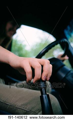 Stock Image - Hand on gear shift. Fotosearch
