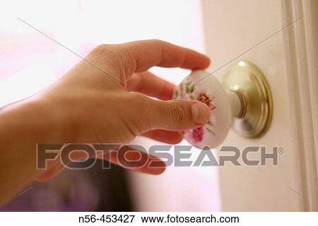 Stock Photo - Hand opening door. Fotosearch