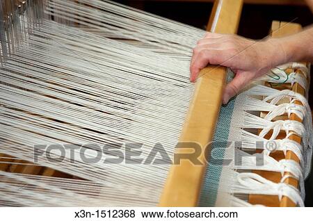 Hand operating loom for weaving View Large Photo Image Stock Photo - Hand operating loom for weaving. Fotosearch