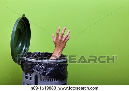 Hand outside bin View Large Photo Image Stock Image - Hand outside bin. Fotosearch