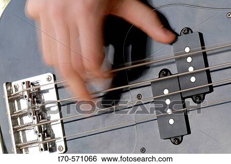 Hand playing bass guitar View Large Photo Image Stock Photograph - Hand playing bass guitar. Fotosearch