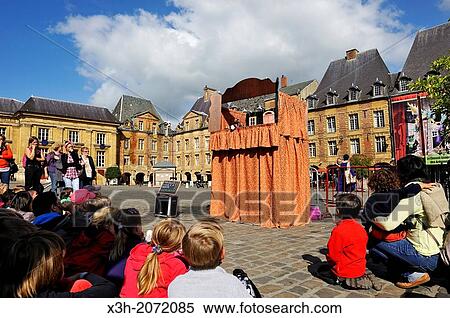 Stock Photography - hand puppets show on the Place Ducale, Festival Mondial des Theatres de Marionnettes world festival of puppets show, Charleville-Mezieres, Ardennes departement, Champagne-Ardenne region, Northern France, Europe.. Fotosearch