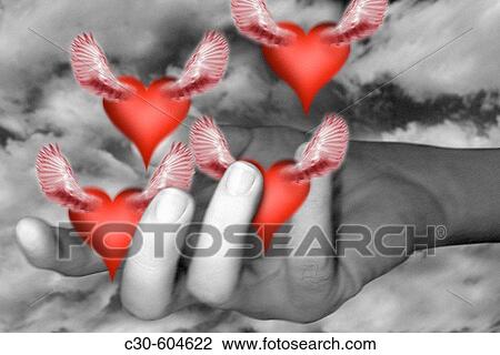 Hand releases symbols of love View Large Photo Image Stock Image - Hand releases symbols of love. Fotosearch