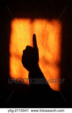 hand shadow on wooden door View Large Photo Image Stock Image - hand shadow on wooden door. Fotosearch