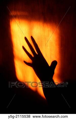 hand shadow on wooden door View Large Photo Image Stock Photo - hand shadow on wooden door. Fotosearch