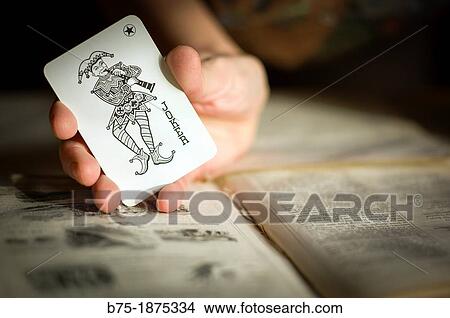 hand showing Joker, the deck of cards View Large Photo Image Picture - hand showing Joker, the deck of cards. Fotosearch